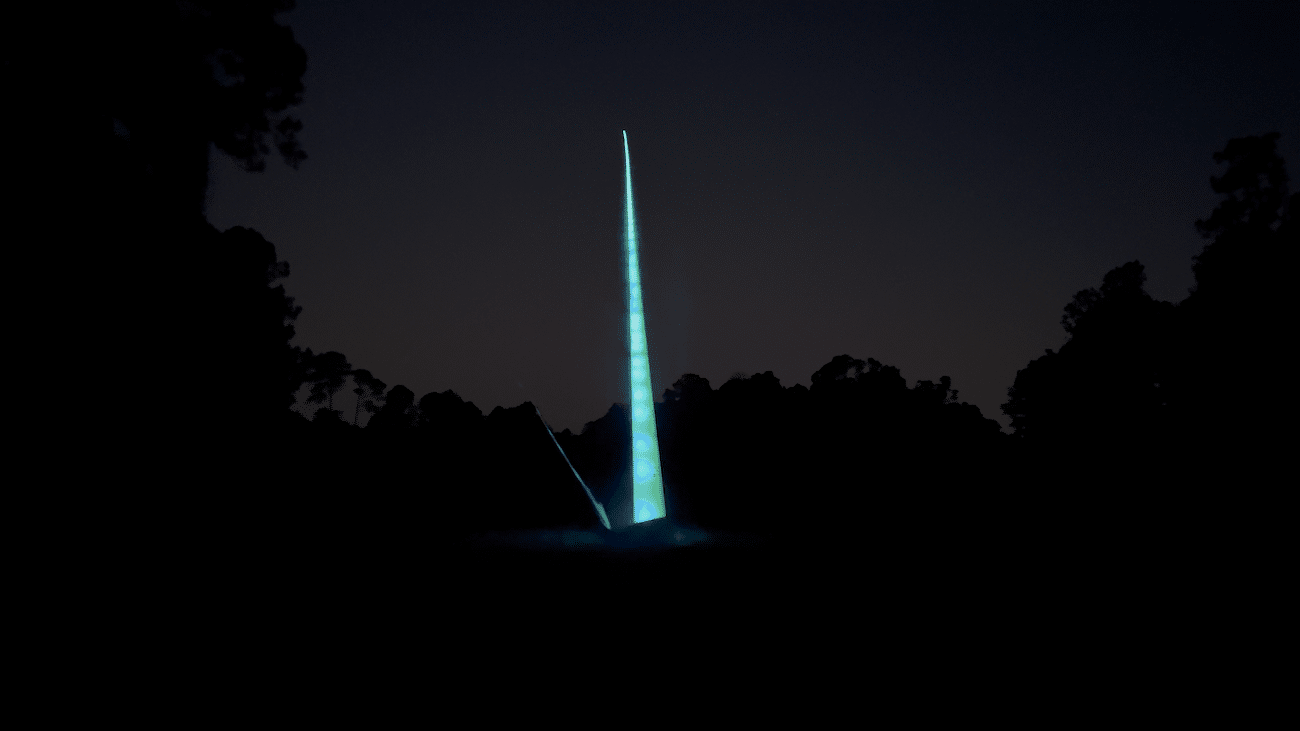 Long Exposure photo of a ball being hit in a Night Golf Tournament